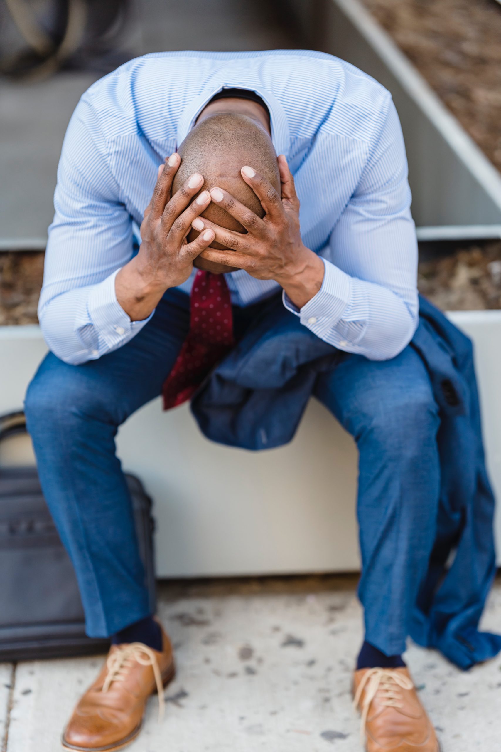 A man with his head in his hands