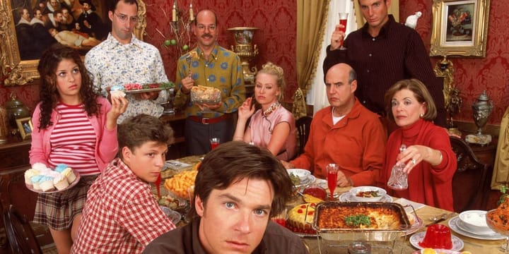 The Bluth family gathered around a meal.