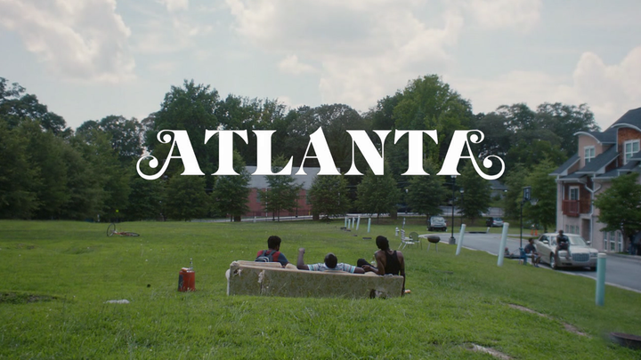 Atlanta title card with Earn, Alfred and Darius on a couch in a lot next to Alfred's house.